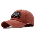 Detailed close-up of Yellowstone National Park bear embroidery on a washed cotton cap - Red