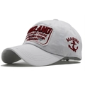 Detailed view of red Oakland embroidery and marine anchor patch on a white cotton cap - White