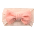 Pink elastic nylon baby headband featuring a large textured bow for infant girls - Flesh Pink