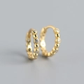 Close-up of gold S925 sterling silver hoop earrings with shimmering crystal accents - 925 Silver / Gold
