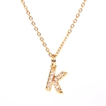 Gold letter K pendant necklace with sparkling pavé crystals on a delicate link chain - Letter K