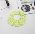 Detail of neon yellow acrylic chunky eyeglass chain with silicone loops on magazine - Goose Yellow