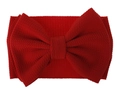 Macro detail of red waffle knit fabric and oversized bow on toddler headband - Red