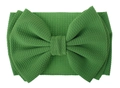 Detail of green oversized bow headband featuring soft waffle knit texture and fabric - Grass Green