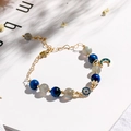 Bracciale in pietra di luna e kyanite blu con ciondoli occhio del diavolo e luna - Bracciale Malocchio