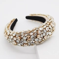 Close-up of luxury Baroque headband featuring sparkling champagne rhinestones on a wide band - Yellow