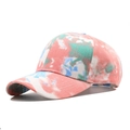 Close-up of tie-dye cotton canvas texture on a six-panel structured baseball cap - Adjustable / Pink & White