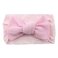 Soft pink nylon baby headband featuring a large textured bow knot for infants - Pink