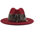 Detail of red fedora hat featuring ethnic ribbon, natural feathers and metal charms - M (56-58cm) / Red
