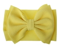 Detail of baby yellow headband showing the textured waffle fabric and large bow - Bright Yellow