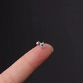 Silver flower stud earring with purple gemstone and white zircons on fingertip - Purple Flower Style (1#S) / Silver