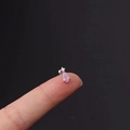 Pink pear-cut zircon cartilage stud earring in silver stainless steel on finger - Pink Water Drop Style (7#S)