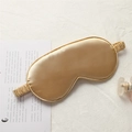 Champagne gold faux silk sleep eye mask with elastic headband on white fabric - With Paper Card / Gold