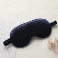Navy blue silk sleep eye mask with elastic strap on elegant decorative background - Navy Blue