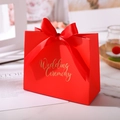 Close-up of red wedding candy box with elegant gold stamping and ribbon handle - Small / Red Wedding Ceremony (Red Ribbon)