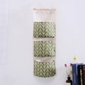 Hanging cotton linen 3-pocket organizer with green chevron pattern on cream fabric - Green Branches