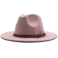Detailed macro view of pink fedora wool hat with brown leather band and gold buckle - Pink