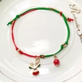 Macro view of Christmas woven bracelet with reindeer charm and red-green cord - Deer Head Charm Style