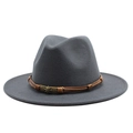 Detail of dark gray wool fedora featuring brown leather braided band and skull emblem - M (55-58cm) / Dark Gray