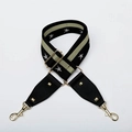 Detail of adjustable star-pattern strap with golden hardware and leather connector - Gold Stars