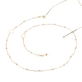 Detail of gold geometric rhombus eyewear chain with small beads on a white background - Diamond