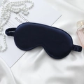 Silk sleep mask in navy blue with elastic strap on white silk background decoration - Navy Blue Eye Mask