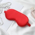 Luxury silk sleep mask in vibrant red satin, presented on white silk with pearls - Red Eye Mask