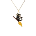 Fashionable black cat on a broomstick necklace with gold chain for Halloween accessories - Green Eyed Cat