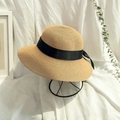 Detail of woven straw sun hat with black ribbon on a stand against a vintage background - Khaki (Adults)