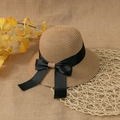 Close-up of hand-woven straw hat texture with an elegant black satin ribbon bow - Khaki (Kids)