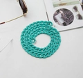 Close-up of turquoise acrylic eyeglass chain with silver metal buckles and rubber loops - Lake Blue