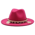 Detail of rose red wool felt fedora with seashell, tassel, and woven decorative band - Rose Red