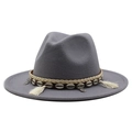 Close-up of grey wool fedora featuring ethnic woven band with shells and tassel charms - Light Gray
