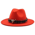 Detail of red wool fedora featuring ethnic woven band and silver bull skull metal ornament - Orange Red
