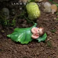 Sleeping baby in green leaf resin miniature for garden decor, size 4.8 x 2.5 x 1.5 cm - Fairy Baby