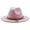 Close-up of pink wool fedora featuring an ethnic woven band and shell pendant detail - Pink