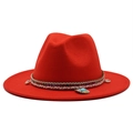 Macro shot of red wool fedora hat featuring ethnic woven band and seashell turquoise detail - Orange Red
