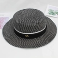 Close-up of woven boater hat with black ribbon and gold metal M hardware detail - M(56-58cm) / Black