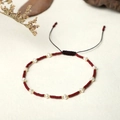 Close-up of handmade woven bracelet with red beads, freshwater pearls and adjustable cord - Red Style (BR0301)