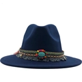 Detailed view of navy felt hat featuring ethnic woven band and turquoise gemstone - Navy Blue