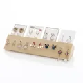 Solid wood jewelry display featuring various S925 silver needle earring styles - SM1907 Multi-hole Earring Board