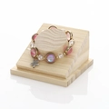 Beaded bracelet with pink gradient beads and starfish charm on wooden jewelry stand - SM1910 Bracelet Display Stand