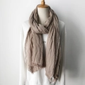 Khaki cotton linen scarf with pleated texture and tassels on a clothing mannequin - Side Stripe Khaki