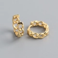 Detailed close-up of golden interlocking chain hoop earrings with a polished finish - Gold