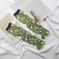 Detailed macro shot of green and purple geometric pattern on cotton blend Tabi socks - 35-41 / Green Candy