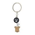 Dog paw and bone charm keychain featuring a Schnauzer dog head on a metal ring - Fox Terrier