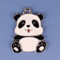 Detailed view of a black and white enamel panda pendant with a small hanging ring - Panda 6