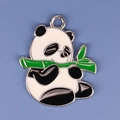 Close-up of DIY panda alloy pendant with green bamboo detail and black and white enamel - Panda 7