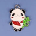 Close-up of a panda charm with red scarf and green bamboo on a blue background - Panda 5