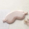 Elegant champagne silk eye mask with elastic headband on soft fabric background - Flesh Pink